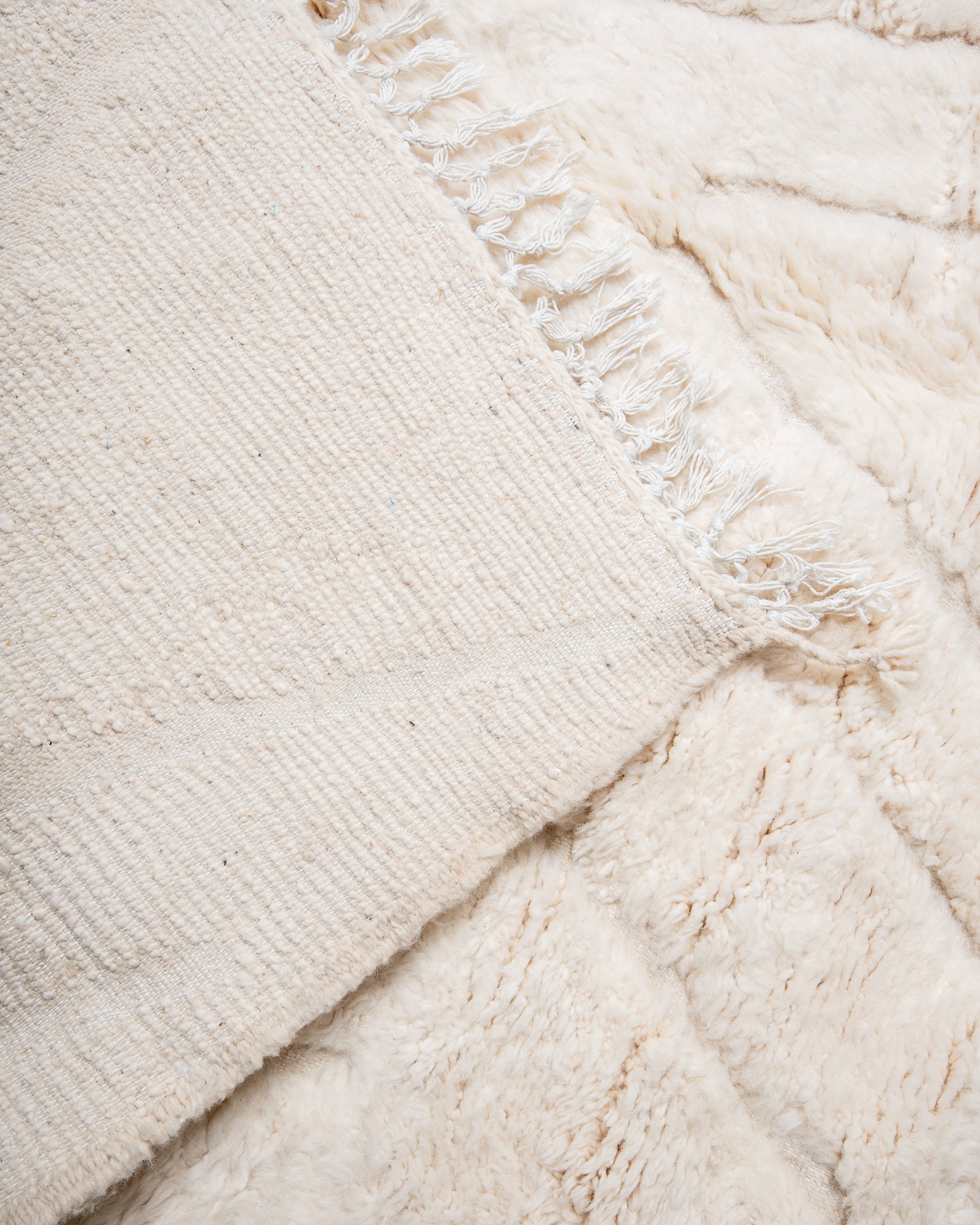 Modern, designer, handcrafted Berber rug from Morocco. Beniourain carpet with beautiful colours and patterns and fluffy wool texture.